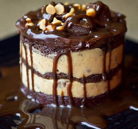 13. This multi-layered cake filled with chocolate chip cookie dough and glazed with heavenly fudge ganache.