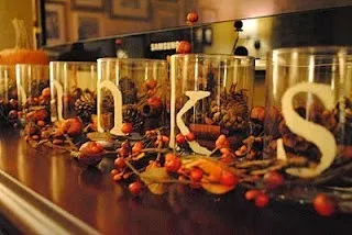 A Time for Thanks- dollar store glass cups, stencil words "thanks" and fill with cinnamon potpourri/candy corn/acorns/pine cones. cheap and pretty thanksgiving decor!