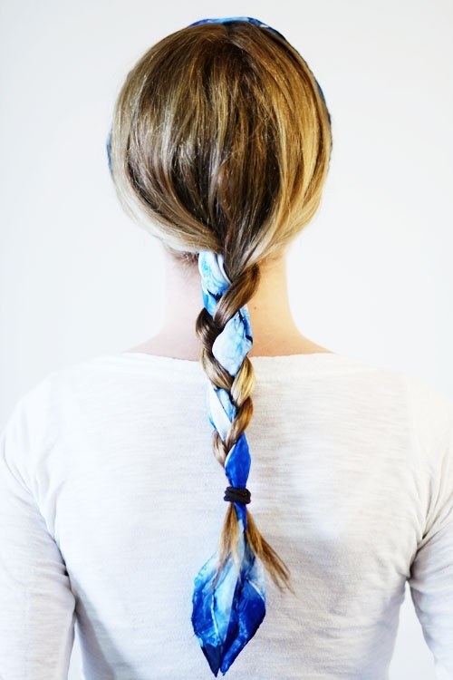 Use a headscarf as your third chunk of hair, incorporating it into your braid.