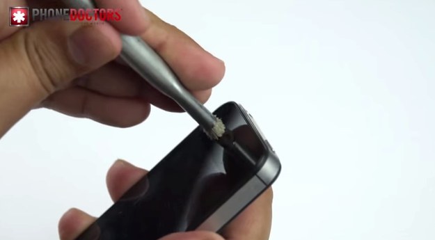 A small paintbrush clears up a phone or tablet's built-in speaker really well.