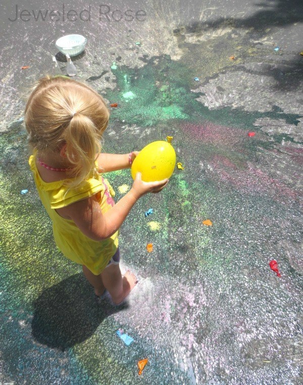 Fill water balloons with water, cornstarch, and food coloring to make awesome splatter paint bombs.