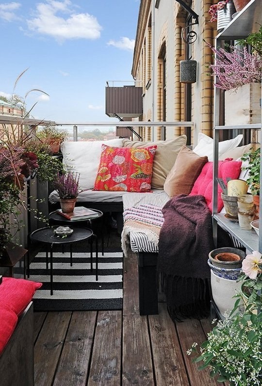 For a big effect on a small budget, get a bench and top it off with some outdoor cushions.