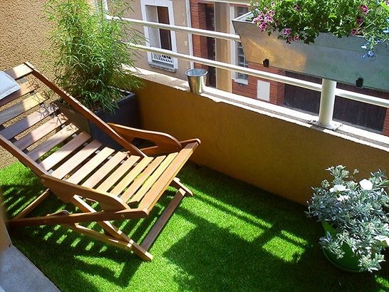If you want a backyard feel, lay out artificial grass.