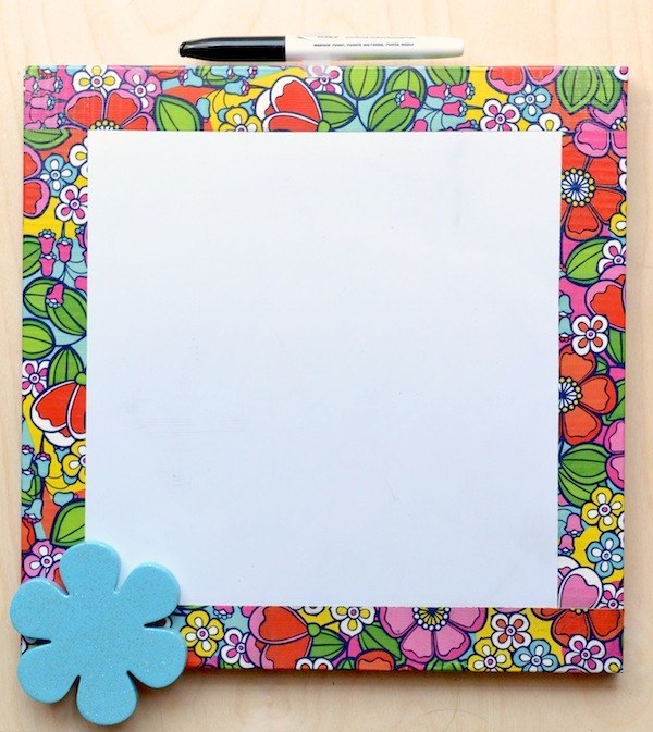 Make over a whiteboard with a picture frame and colorful tape.