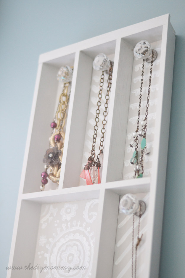Transform a silverware organizer into a jewelry rack.
