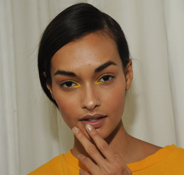 Use some shimmery gold shadow just on the inner corners of your eyes.