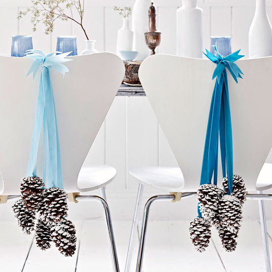 Hang some wintry pinecone garlands on your guests' seating.