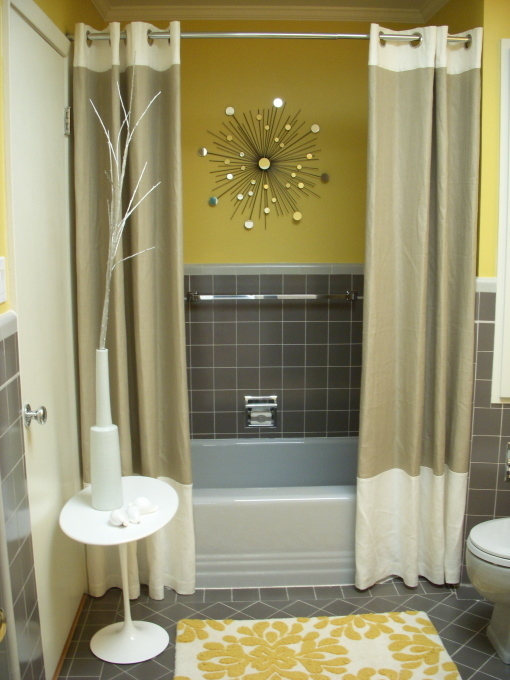 8. Create a focal point, like your shower curtain, to draw visual attention to a single place.