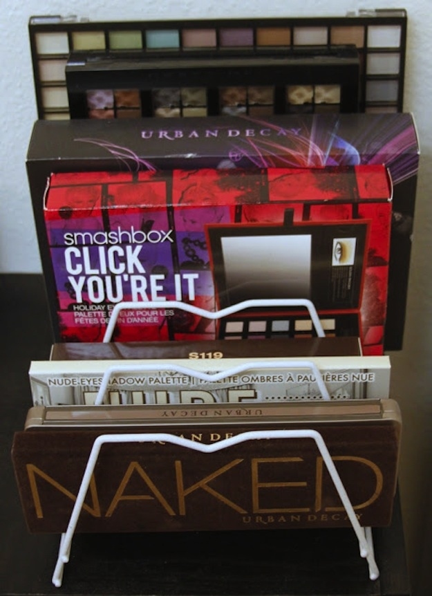 Use a magazine rack to bring order to stacks of big palettes.